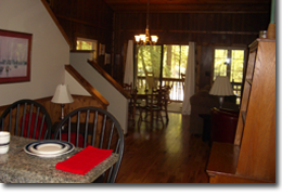 View from the kitchen to the dining area in A Cabin on Paradise Murphy NC