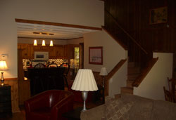 View of the Kitchen and the Stairs to the loft in A Cabin on Paradise Murphy NC